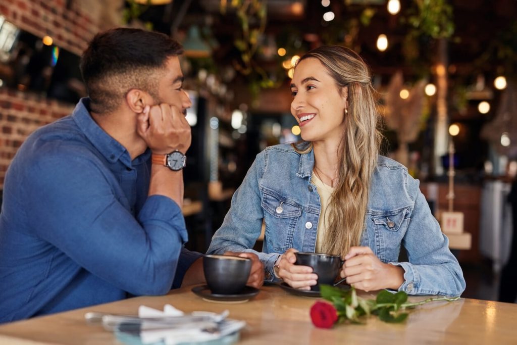 hispanic man and woman casually dressed for a coffee date