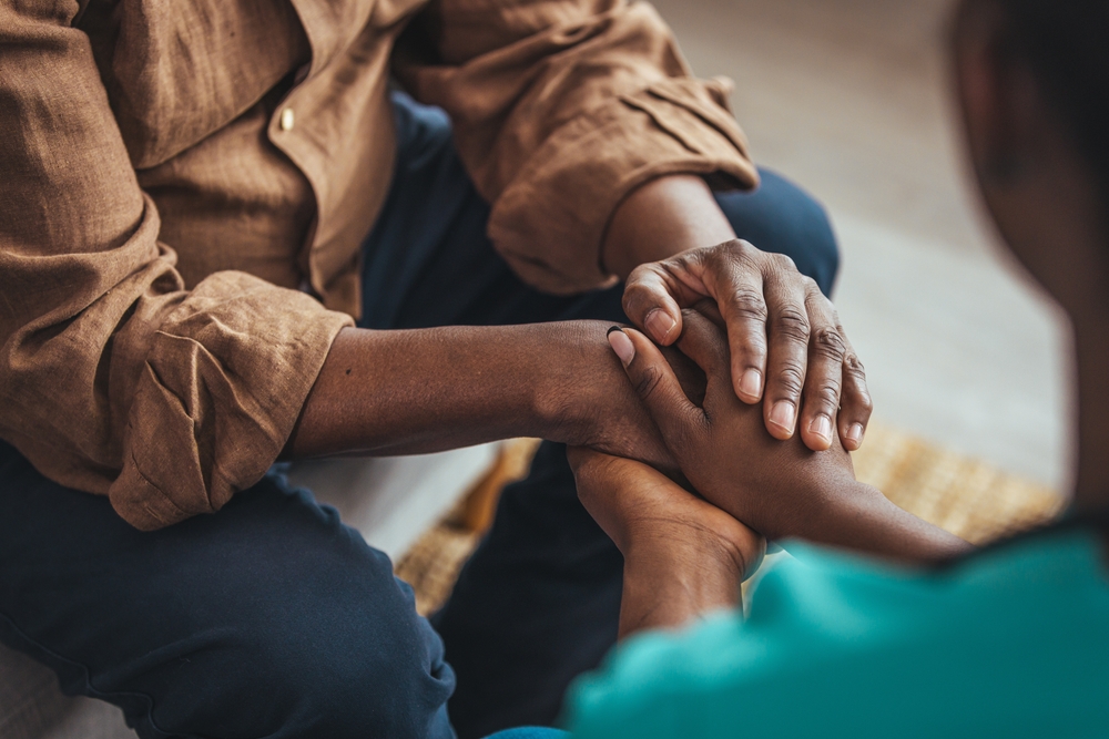 close up of support hands of woman comforting counseling 